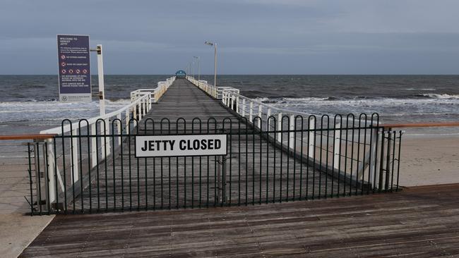 The Henley Beach Jetty will share in $9.3m ... this picture shows it closed after a wild storm. Picture: Campbell Brodie.