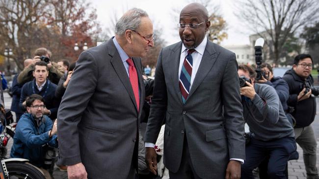 Senate majority leader Chuck Schumer welcomes Raphael Warnock on his return to Washington on Wednesday. Picture: AFP