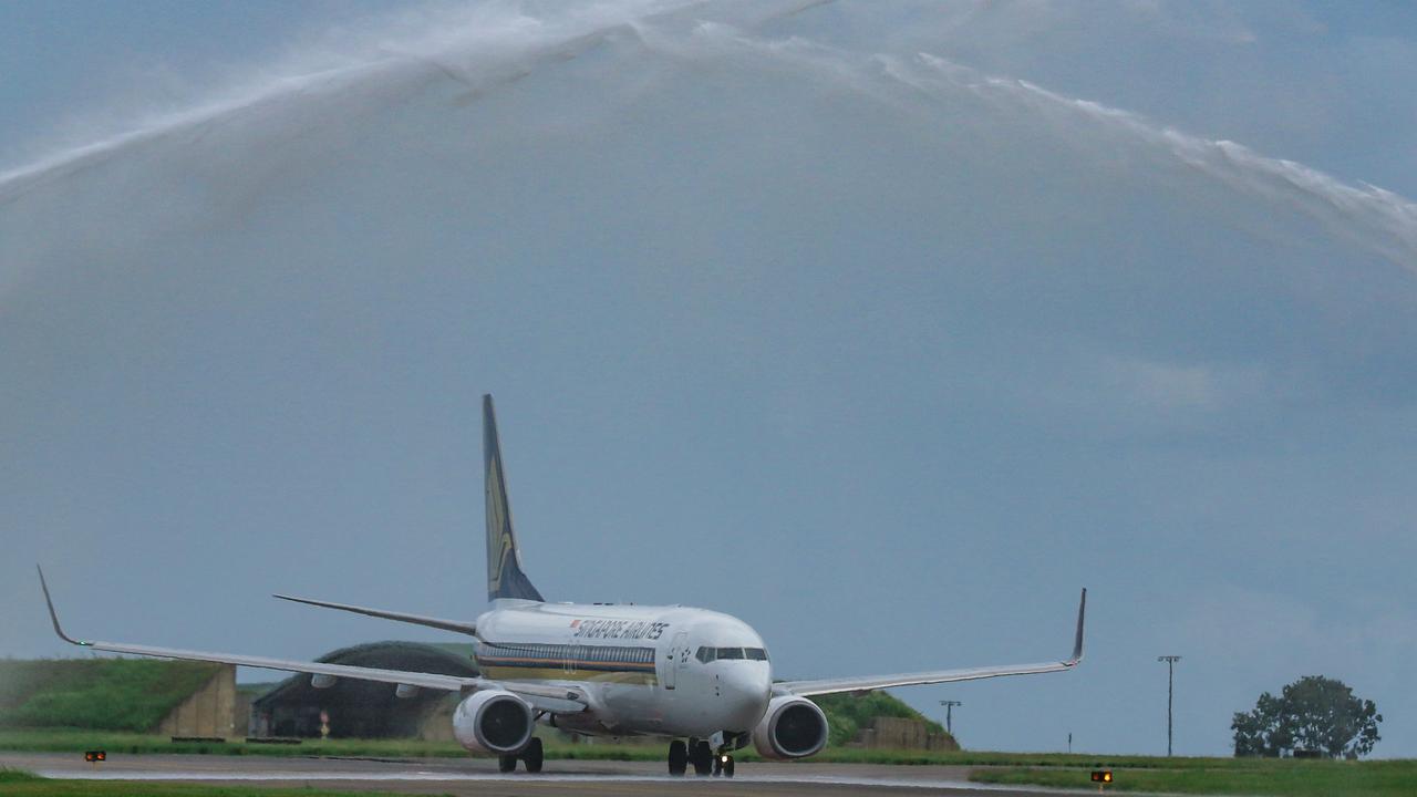 A water salute as the First SIngapore Airlines regular service lands in Darwin today. Picture: Glenn Campbell