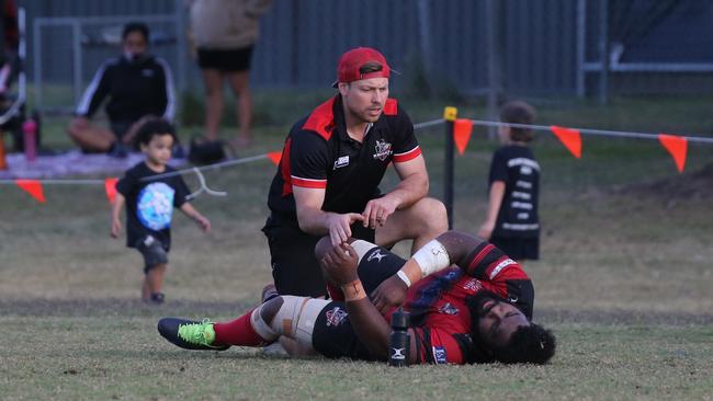 Gold Coast District Rugby Union (GCDRU) Grand Final 2021. Griffith Uni Colleges Knights v Helensvale Hogs at Rugby Lane, Helensvale on 18 September 2021. Lesi Semi receives injury treatment. Pic Mike Batterham