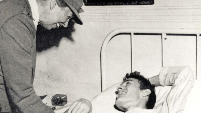 Eleanor Roosevelt visits a sick soldier in 1942.