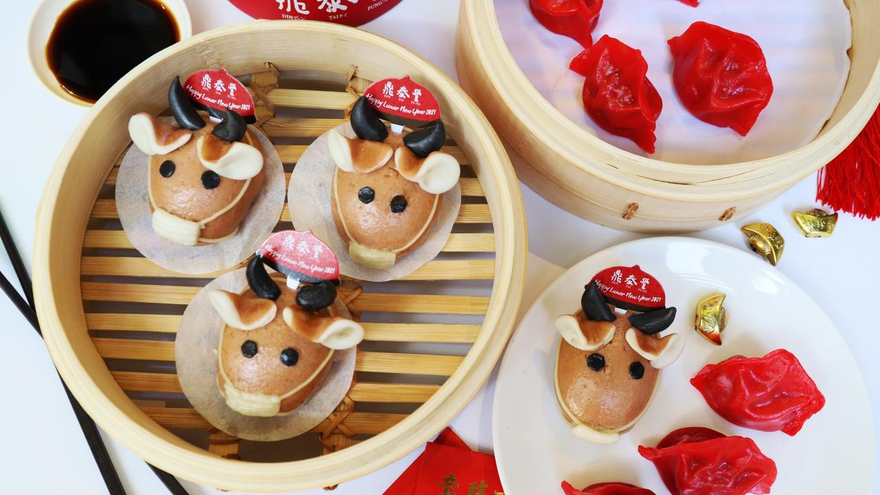 Red packaging, gold fortune cookies and ox-shaped treats from Din Tai Fung restaurant in Melbourne. Picture: Jenifer Jagielski