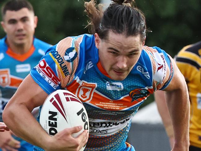 Pride's Tom Chester is chased by Thallon Peters after making a tackle break in the Hostplus Cup Queensland Rugby League (QRL) match between the Northern Pride and the Sunshine Coast Falcons, held at Barlow Park, Cairns Picture: Brendan Radke