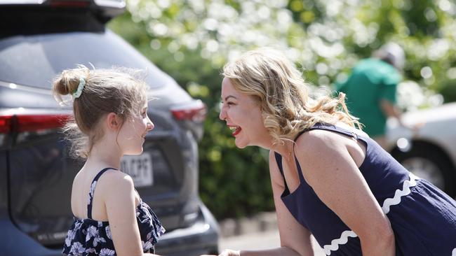 Liberal candidate Amanda Wilson on election day speaking to Melissa, 9, of Sheidow Park at Woodend Primary School. Picture: Brett Hartwig