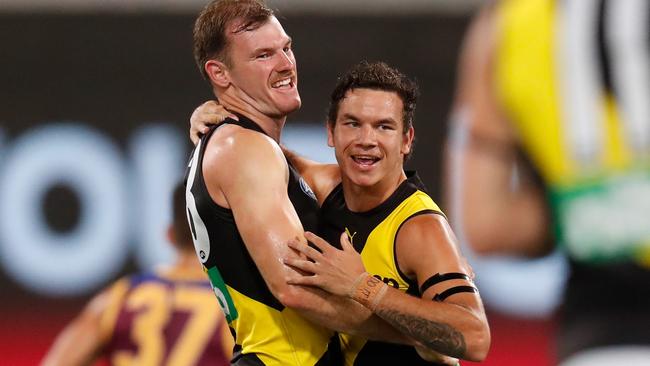 McIntosh and Daniel Rioli celebrate his goal against the Brisbane Lions last week.