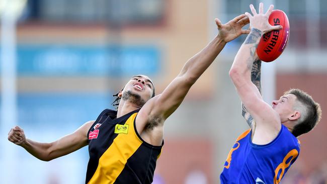 Lachlan Rayner of Taylors Lakes marks over Michael Mayne of Westmeadows during the 2024 Essendon District Football League Division Two grand final. Photo by Josh Chadwick