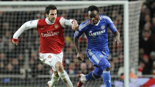 Arsenal's Cesc Fabregas (L) competes with Chelsea's Michael Essien in 2010.