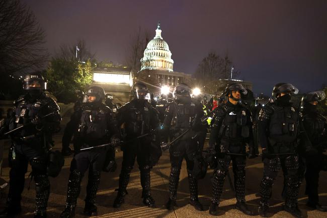 WASHINGTON, DC: Police officers in riot gear line up as protesters gather outside the U.S. Capitol. Picture: Tasos Katopodis/Getty Images/AFP