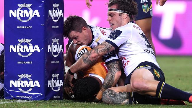 Tevita Pangai Junior scores a try for the Broncos against the Cowboys.