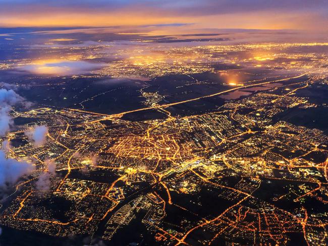 ESCAPE:  Beautiful aerial cityscape view of the city of Leiden, the Netherlands, after sunset at night in the blue hour Picture: Istock