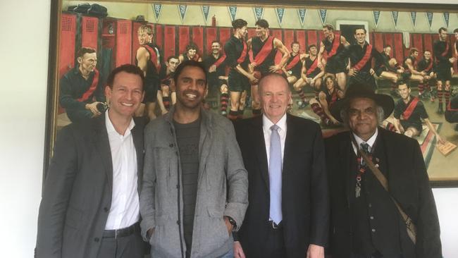 Nathan Lovett-Murray with Essendon CEO Xavier Campbell, chairman Lindsay Tanner and his father Gary.