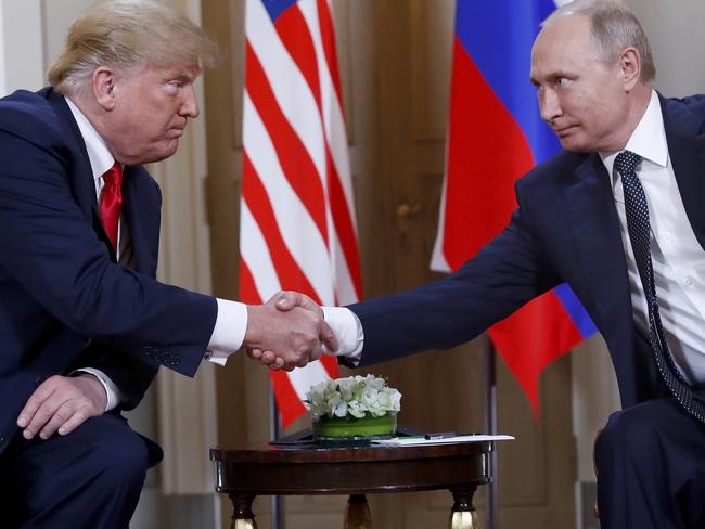 President Donald Trump President Vladimir Putin shake hands at the meeting at the Presidential Palace in Helsinki. Picture: AP