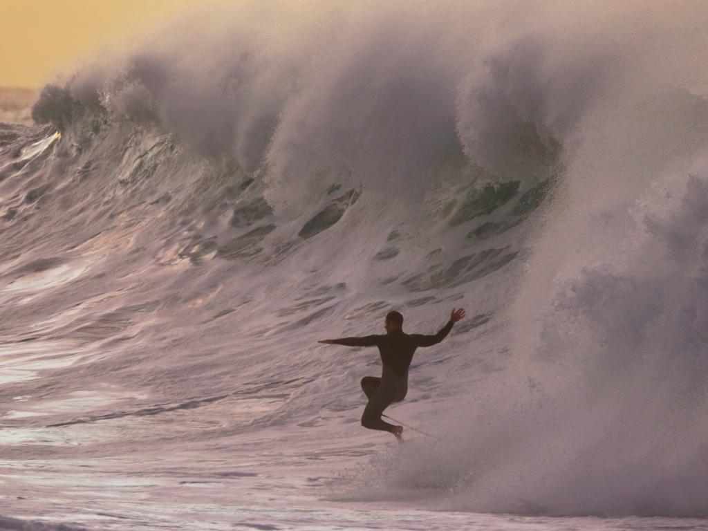 A massive swell has hit the Sydney coast overnight to the delight of some surfers at Bronte. Picture: John Grainger