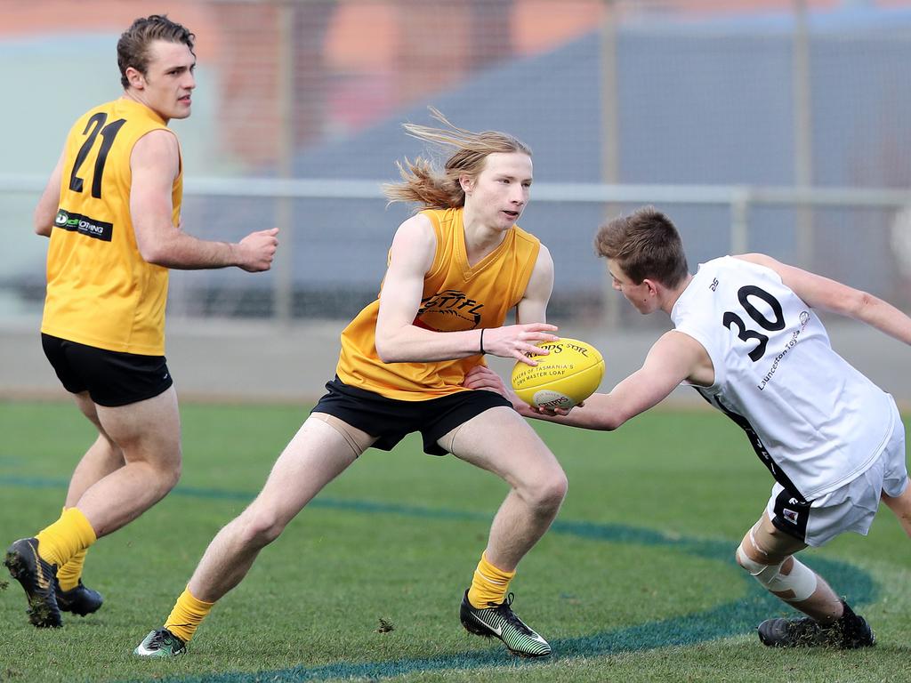 Under 16 Boys STJFL vs. NTJFA match, North Hobart Oval: South's Edward Wright evades a tackle. Picture: LUKE BOWDEN