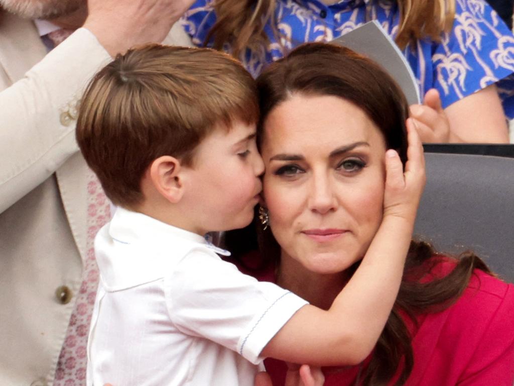 It wasn’t all funny faces, mum Kate got a kiss too. Picture: Chris Jackson/AFP