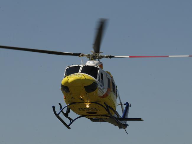 RACQ Careflight helicopter lands on the oval of Mary McKillop Catholic School, at Highfields. Student, Patrick O'Sullivan, was rushed from the school earlier this year, to Mater Children's Hospital in Brisbane, after falling 10 metres from an amusement ride.Photo:  Bev Lacey / The Chronicle