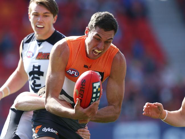 Greater Western Sydney's Tom Downie handballs during AFL match GWS Giants v Carlton at Spotless Stadium. Picture. Phil Hillyard