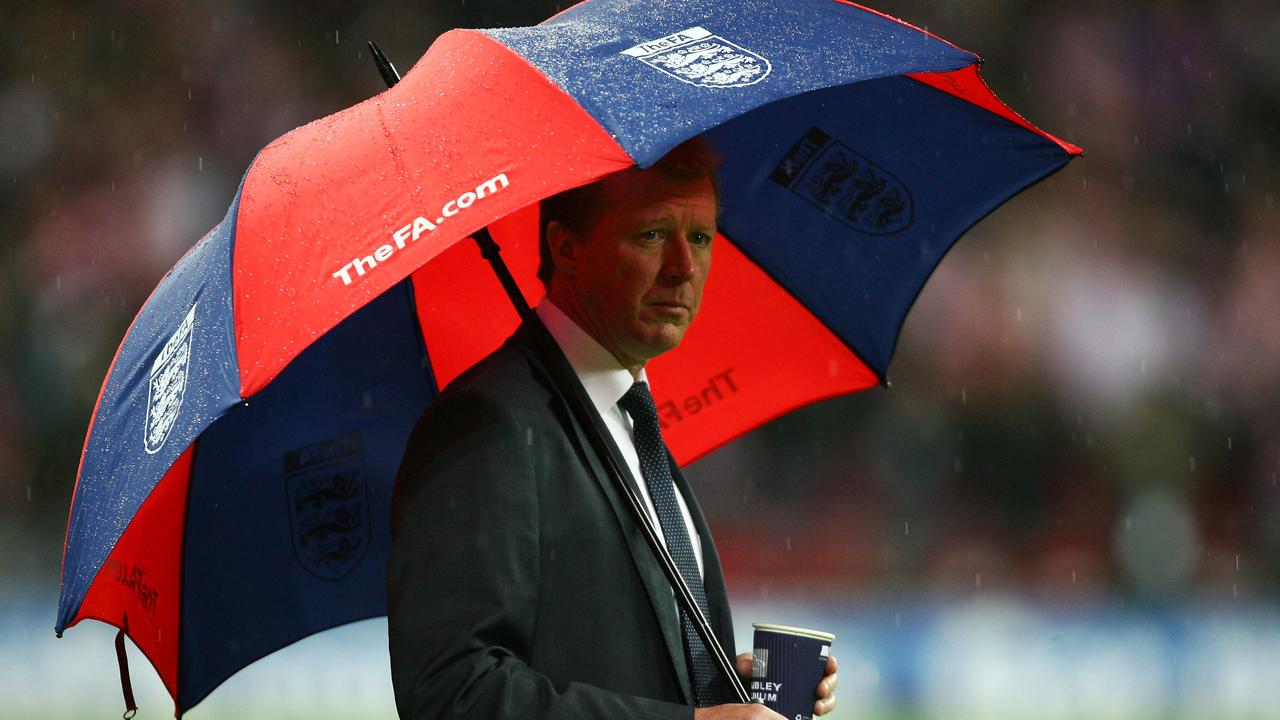 'The Wally with the Brolly' - Steve McClaren looks on from under his umbrella.
