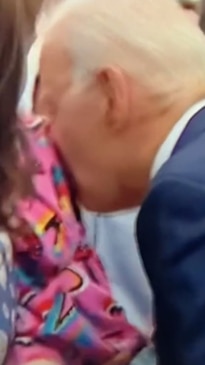 Biden 'nibbles' little girl's shoulder