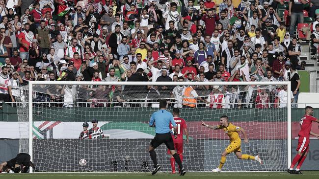 Australia's Jamie Maclaren celebrates after scoring the opening goal against Palestine in their Group B Asian Cup clash. Picture: AP