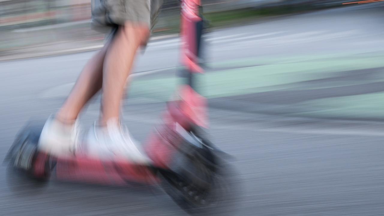 A man is riding an e-scooter (shot with long shutter speed). T Photo: Christian Charisius/dpa (Photo by Christian Charisius/picture alliance via Getty Images)