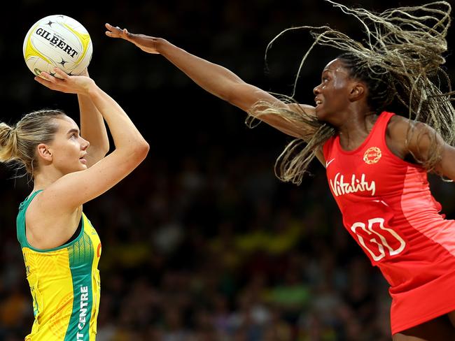 Funmi fadoju flies high to defend the shot of Kiera Austin. Picture: Getty Images