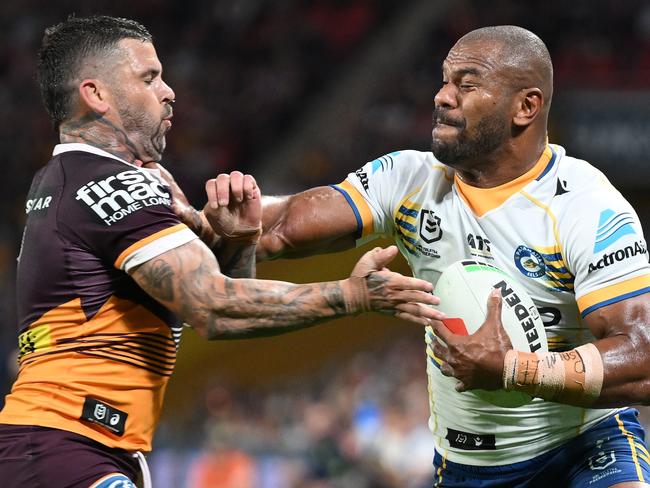 BRISBANE, AUSTRALIA - AUGUST 23: Maika Sivo of the Eels is tackled by Adam Reynolds of the Broncos during the round 25 NRL match between Brisbane Broncos and Parramatta Eels at Suncorp Stadium, on August 23, 2024, in Brisbane, Australia. (Photo by Matt Roberts/Getty Images)