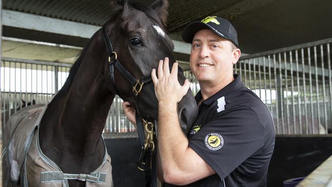 Trainer Tony Gollan with his Queensland Oaks runner Good Soize in the stables at Eagle Farm. Picture Lachie Millard