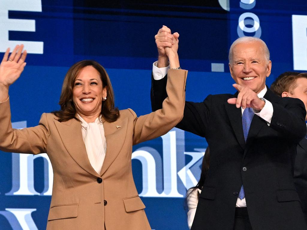 US President Joe Biden holds US Vice President and 2024 Democratic presidential candidate Kamala Harris hand after delivering the keynote address on the first day of the Democratic National Convention (DNC) at the United Center in Chicago on August 19. Picture: Robyn Beck / AFP