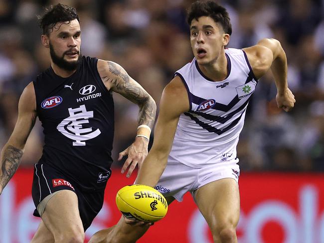 AFL Round 3.   03/04/2021.  Carlton vs Fremantle at Marvel Stadium, Melbourne.   Adam Cerra of the Dockers looks to give infant of Zac Williams of the Blues during the 1st qtr.   . Pic: Michael Klein