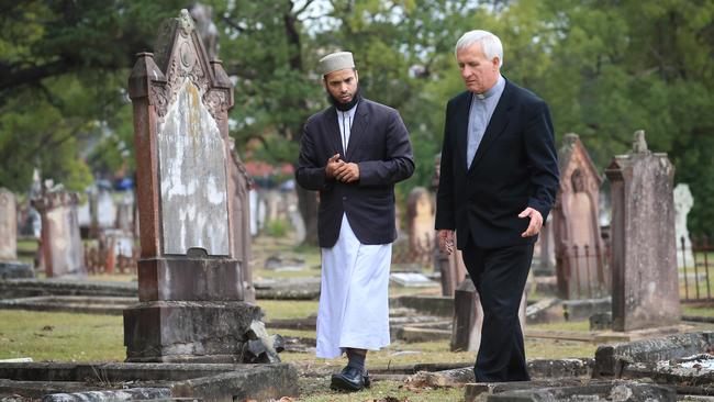 Imam Mohammad Abu Hurayra and Father Joseph Kolodziej, who both regularly officiate at burials at Rookwood Cemetery in Sydney’s west. Picture: John Feder