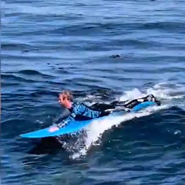 Nick Ericksen quickly paddled to shore once he got hold of his board. Picture: Chad Underhill-Meras