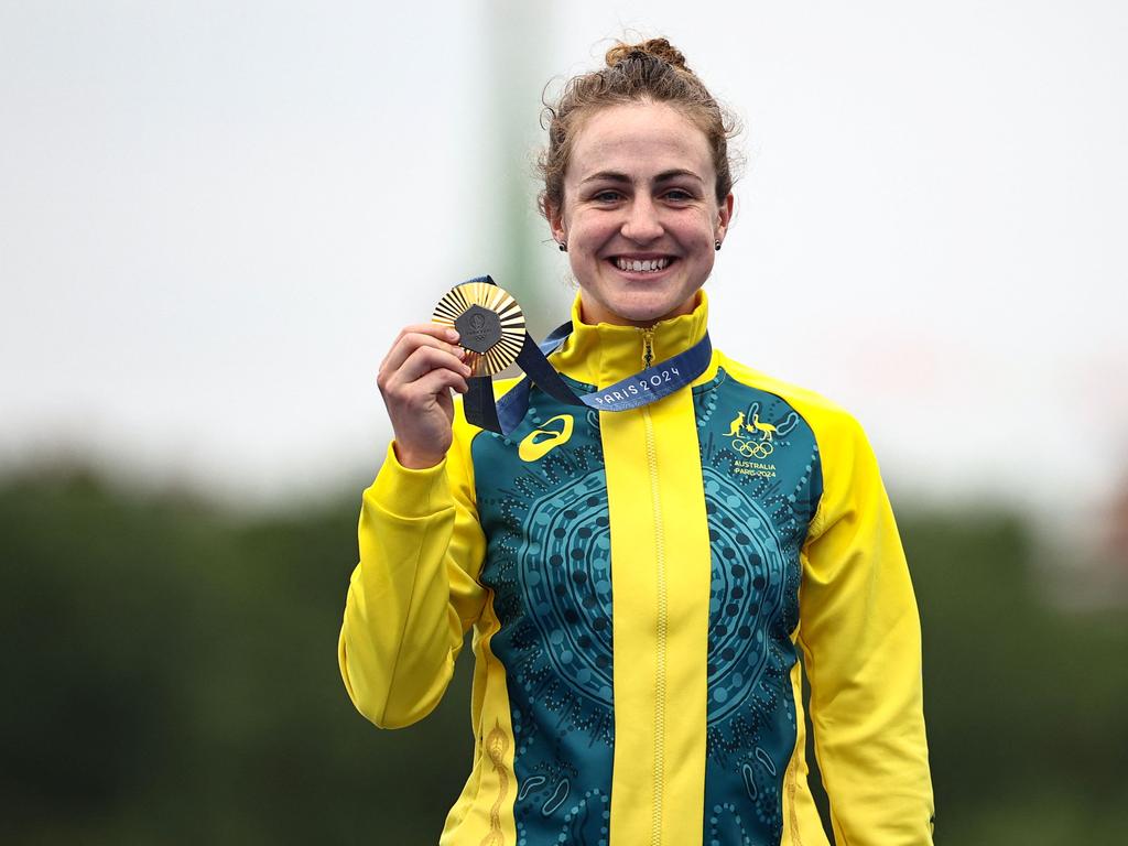 Australia's Grace Brown celebrates with her gold medal after winning the women's road cycling individual time in Paris. Picture: AFP