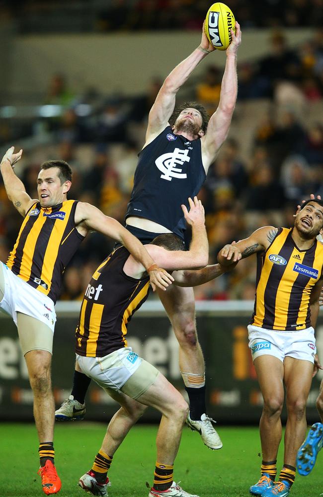 Sam Rowe rises between three Hawks to mark strongly. Picture: Getty