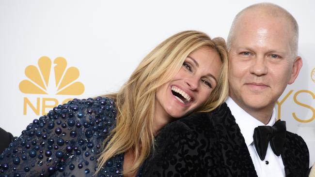 Rest your head ... Julia Roberts leans on Ryan Murphy in the press room at the Emmy Awards. Picture: AP