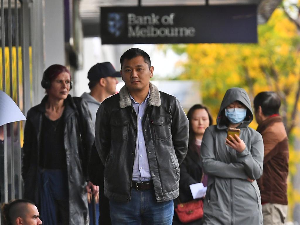 People queue up outside a Centrelink in Melbourne on April 20 as the lockdown gripped the country. Picture: William WEST / AFP.