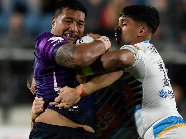 SUNSHINE COAST, AUSTRALIA - JULY 17: Albert Vete of the Storm is tackled during the round 10 NRL match between the Melbourne Storm and the Gold Coast Titans at Sunshine Coast Stadium on July 17, 2020 in Sunshine Coast, Australia. (Photo by Matt Roberts/Getty Images)