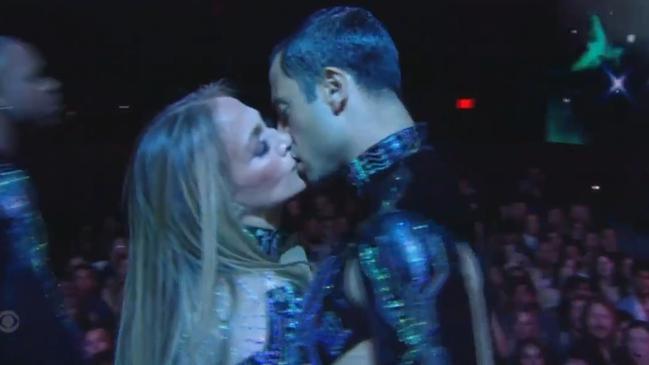 Jennifer Lopez kisses not one but three back-up dancers at the AMAs on May 27.
