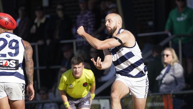 Chelsea’s Lachlan Shaw fires off a handball. Picture: Valeriu Campan