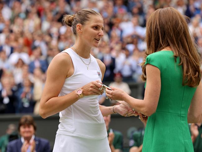 Karolina Pliskova of the Czech Republic is presented with the runners-up trophy by Catherine, the Duchess of Cambridge. Picture: Getty Images