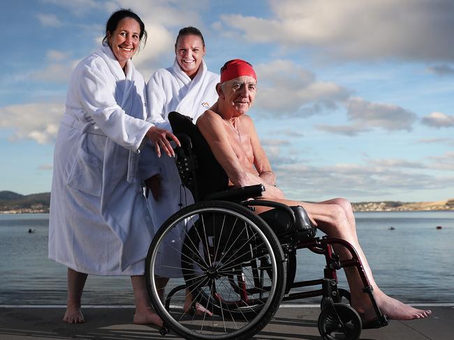 Graeme Mineall, 74, of Launceston, with Masonic Care Tasmania support staff Angie Cassidy, left, and Sarah Franks took part in this year’s Dark Mofo nude swim. Picture: SAM ROSEWARNE