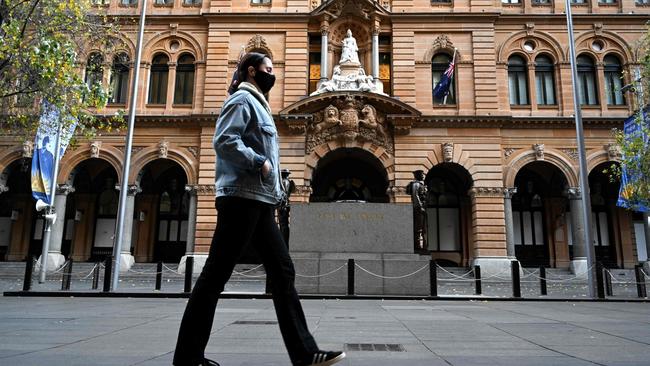 A woman in an otherwise deserted Martin Place in Sydney on Tuesday. Picture: AFP