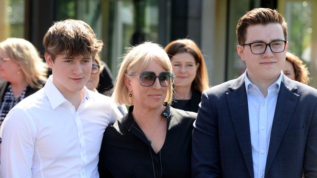 Catherine Andrews and kids watch as her husband Daniel Andrews announces his retirement at Parliament House in Melbourne. Picture: NCA NewsWire