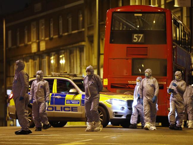 Forensic officers examining the scene where a man was shot and killed by armed police in London. Picture: Hollie Adams/Getty