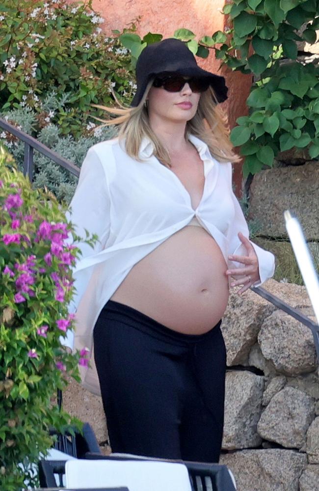 Margot Robbie looks radiant as she shows off her growing baby bump while on holiday with her husband Tom Ackerley and friends in Sardinia. Picture: CIAOPIX / COBRA TEAM / BACKGRID