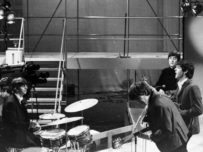 Beatles rock band recording in television studio in Australia in 1960s.
