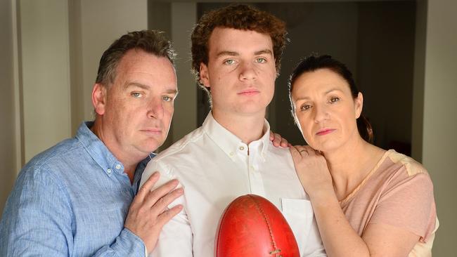 Ethan Cheesewright, 17, with his dad Tim and mum Katrina. Ethan has been forced to quit playing elite footy because of concussion. Picture: Nicki Connolly.