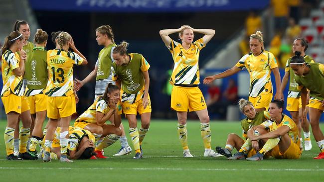 The Australia players look dejected after losing the penalty shoot out. Picture: Getty Images