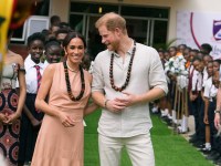 Prince Harry and Meghan visit children at the Lights Academy in Abuja, Nigeria. Picture: AP Photo/Sunday Alamba.
