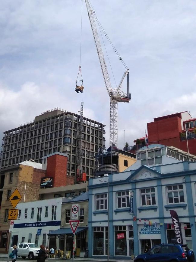 A Mercury reader took this picture of heavy equipment being craned to the top of 10 Murray St as part of the long-awaited demolition process.